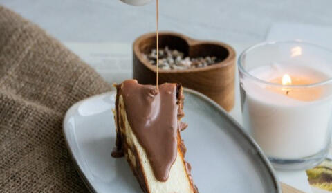 chocolate sauce poured on dessert cake